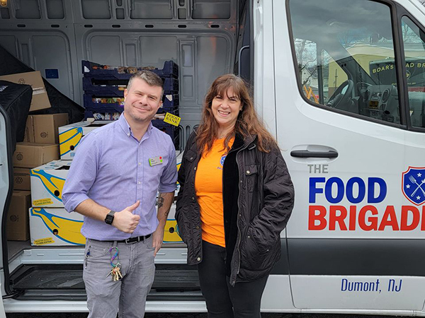 Dumont Stop & Shop Assistant Manager Keith Stedtler with Food Brigade President Karen DeMarco